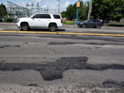 Drivers pass rough road conditions along Northeast 112th Avenue. On average, there is a crash along the roughly 3-mile road every 4&frac12; days, and 4 percent of those crashes result in serious injuries or fatalities, according to an analysis conducted by the city of Vancouver. Since 2014, four pedestrians and one bicyclist have been killed while using the roadway.