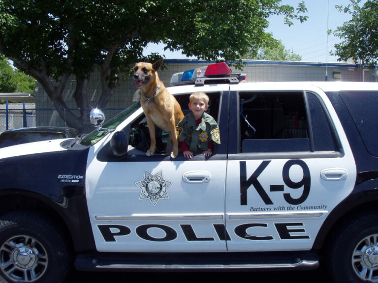 Bryson Layton poses alongside his father&rsquo;s police K-9 in his father&rsquo;s patrol vehicle from the Las Vegas Metropolitan Police Department. The now 22-year-old said his father inspired him to pursue a career in law enforcement.