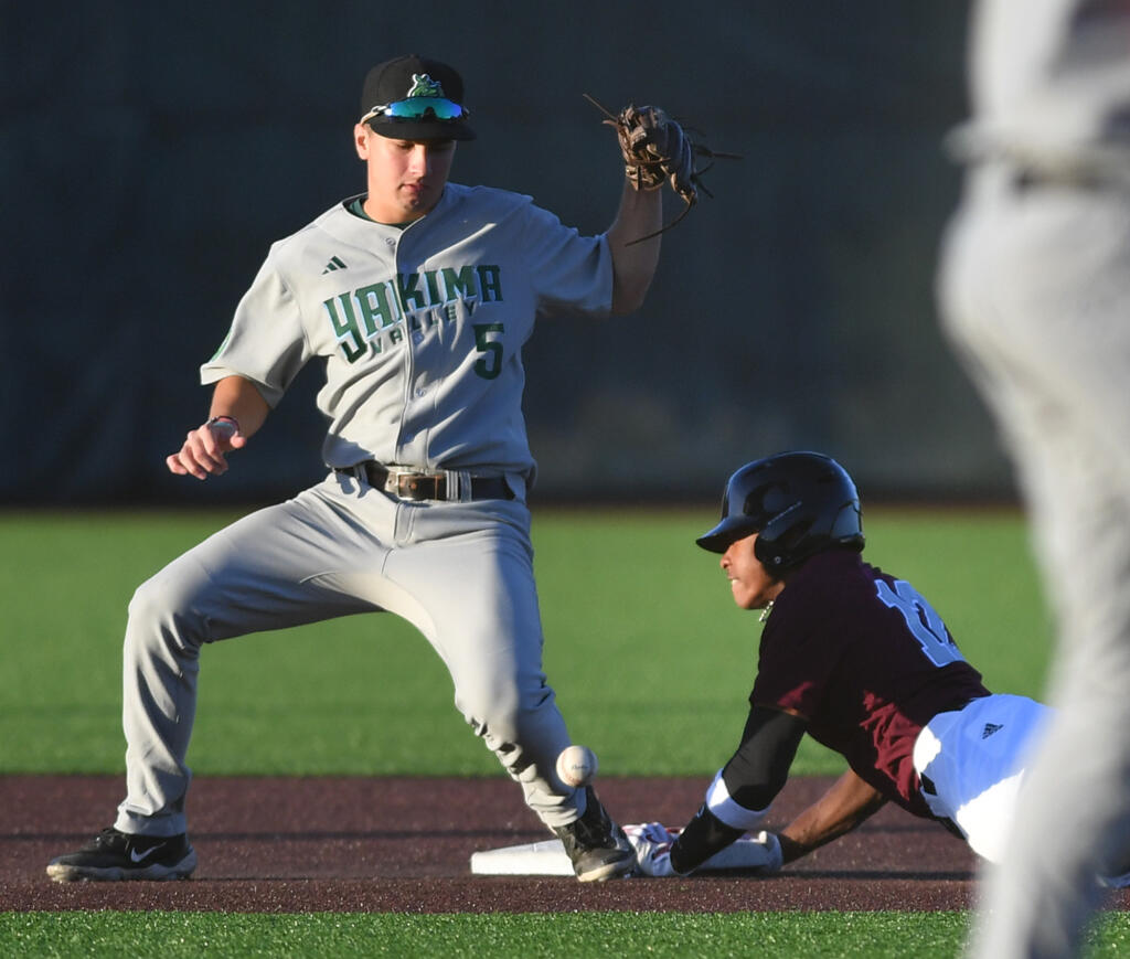 Ridgefield's Dasan Harris, right, steals second base from Yakima Valley's Gavin Brubaker Tuesday, June 11, during the Raptors’ 10-0 win against Yakima Valley Pippins at the Ridgefield Outdoor Recreation Complex.