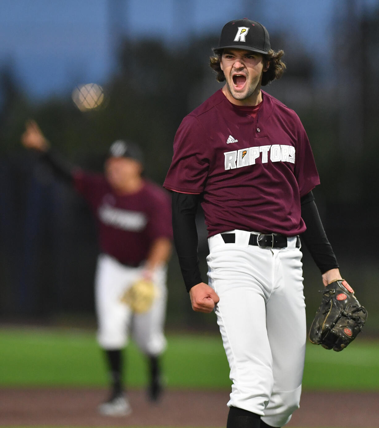 Ridgefield's Mac Elske celebrates after getting the last out in a combined no-hitter Tuesday June 11, 2024, during the Raptors’ 10-0 win against the Yakima Valley Pippins at the Ridgefield Outdoor Recreation Complex.