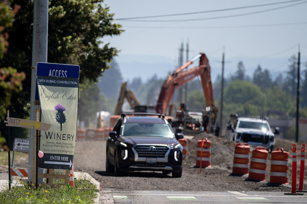 As Southeast First Street is under construction, patrons of English Estate Winery might be confused by roadwork and how they can access the winery, which is open for business. The winery does most of its business in the summer. At top, a sign guides visitors to the winery entrance.