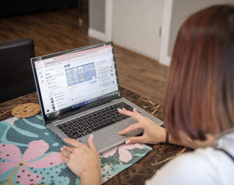 Jasmine Yamamoto checks the eXp Realty site at her house in Vancouver. She said it took discipline and a lot of penny-pinching in order to save for a down payment and closing costs on her home.