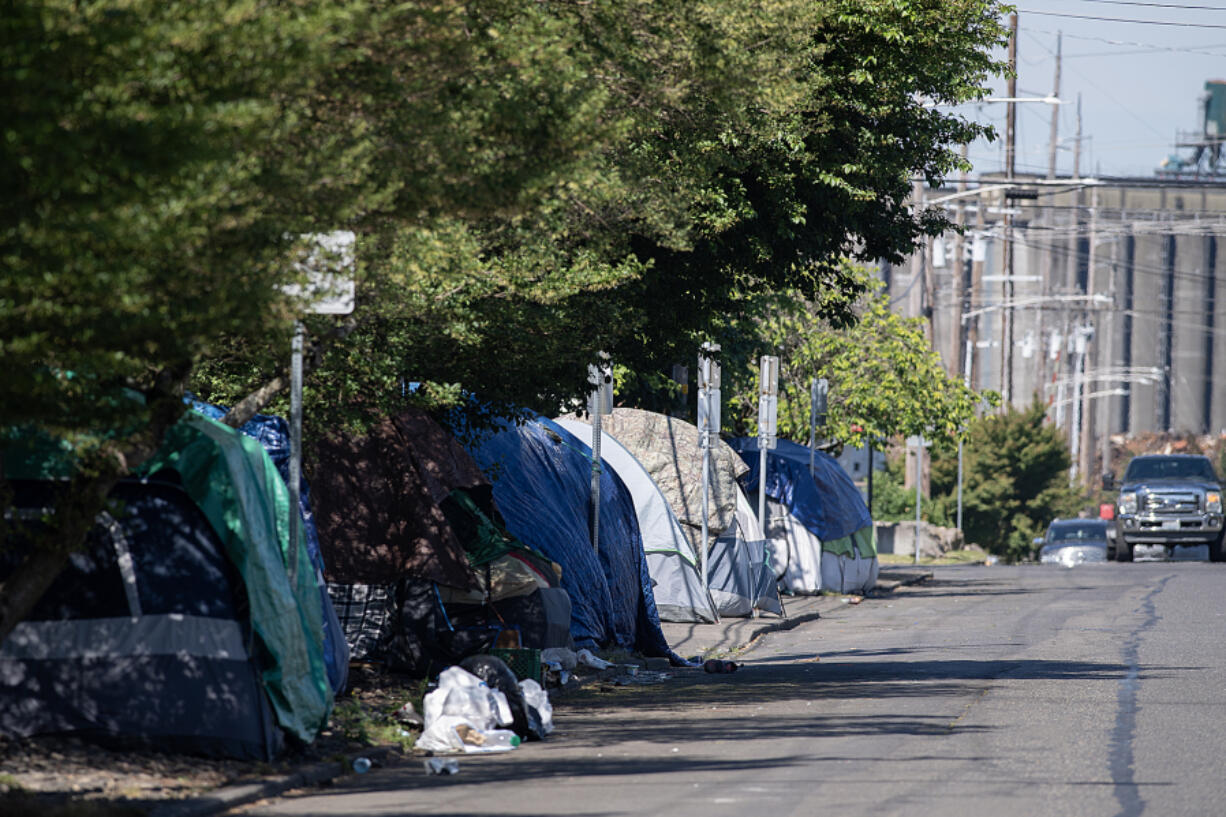 Tents line the side of the road along West 11th Street in downtown Vancouver. A so-called bridge shelter in the city will house up to 150 people experiencing homelessness.