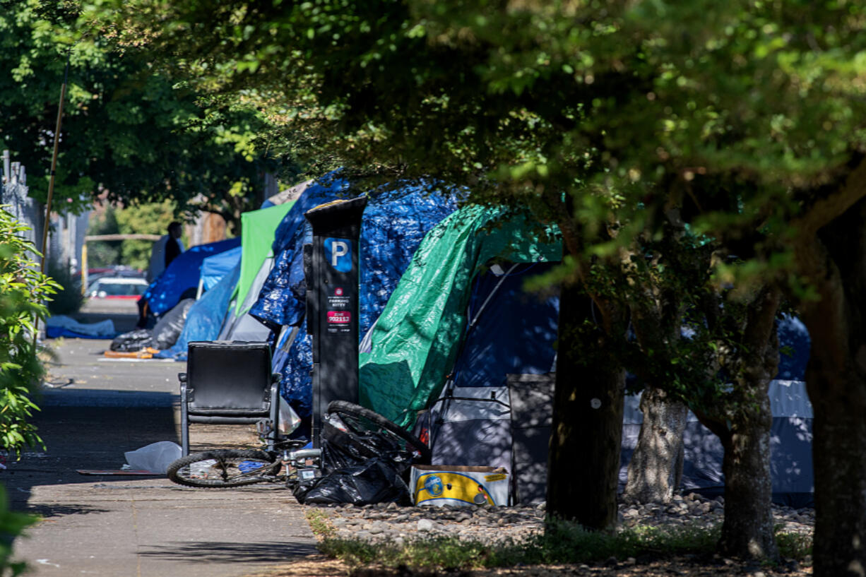 LEADOPTION Tents line the side of the road along West 11th Street in downtown Vancouver in June.