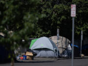 Tents line the side of the road along West 11th Street in downtown Vancouver. A bridge shelter is part of the city&rsquo;s plan to address homelessness since declaring a civil emergency in November.