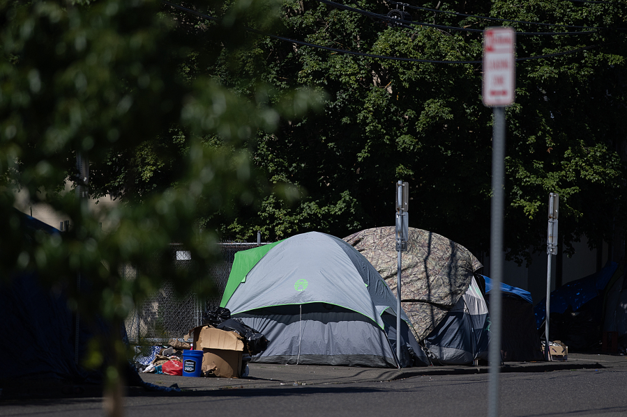 Tents line the side of the road along West 11th Street in downtown Vancouver. A bridge shelter is part of the city&rsquo;s plan to address homelessness since declaring a civil emergency in November.