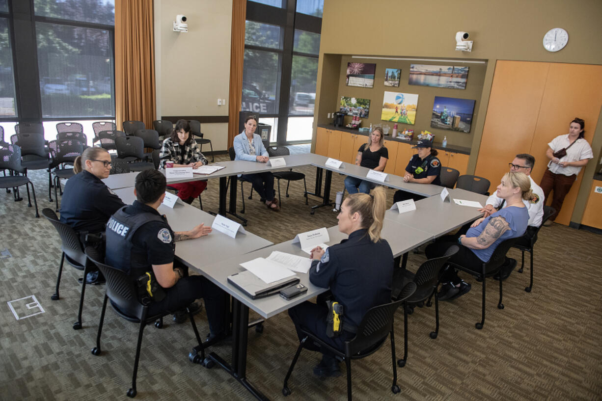 U.S. Rep. Marie Gluesenkamp Perez, D-Skamania, wearing plaid, convened a roundtable about child care with Clark County first responders at Vancouver City Hall on Thursday morning. The event focused on the needs of first responders, such as police and firefighters, who work odd shifts.