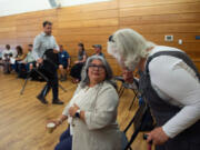 Councilor Diana Perez speaks with constituent Jan Kelly of Vancouver at the Vancouver City Council's second community forum of the year.