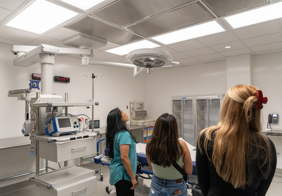 Tour attendees look around a trauma room at the new emergency room at PeaceHealth Southwest Medical Center in Vancouver.