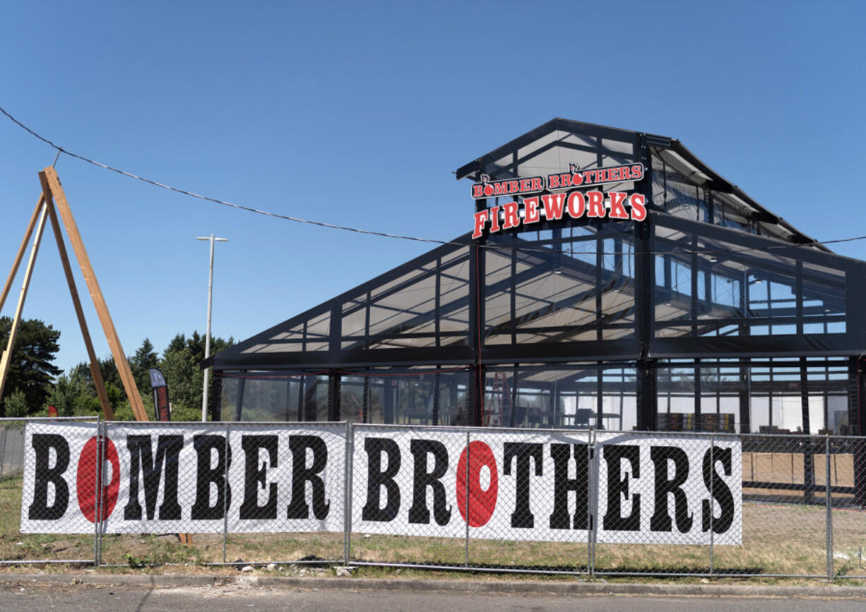 Signs mark the Bomber Brothers fireworks stand Tuesday in Clark County, just north of Vancouver city limits. Fireworks go on sale Friday for Independence Day, which is more than a week away. Setting off fireworks is banned within Vancouver city limits but legal during specified times elsewhere in Clark County.