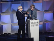 Inductee Donald Fagan, left, of Steely Dan, receives his award from Trey Anastasio at the Songwriters Hall of Fame Induction and Awards Gala on June 13.