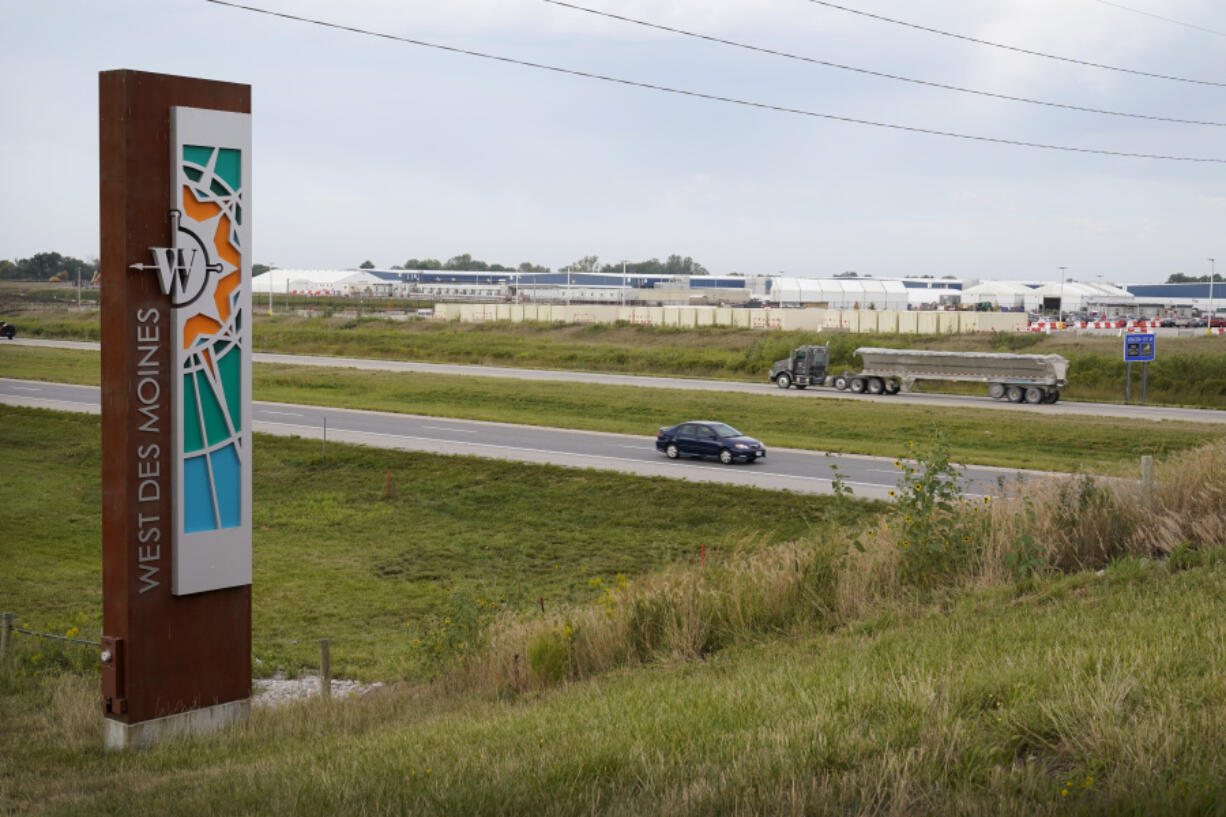 FILE - Traffic on Interstate 35 passes a Microsoft data center on Sept. 5, 2023, in West Des Moines, Iowa. Artificial intelligence systems like ChatGPT could soon run out of what keeps making them smarter &mdash; the tens of trillions of words that people have written and shared online.