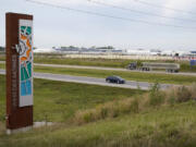 FILE - Traffic on Interstate 35 passes a Microsoft data center on Sept. 5, 2023, in West Des Moines, Iowa. Artificial intelligence systems like ChatGPT could soon run out of what keeps making them smarter &mdash; the tens of trillions of words that people have written and shared online.