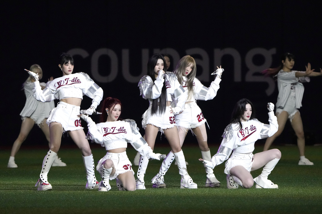 The K-pop group (G)I-dle performs prior to a baseball game at the Gocheok Sky Dome in Seoul, South Korea Thursday, March 21, 2024, in Seoul, South Korea.