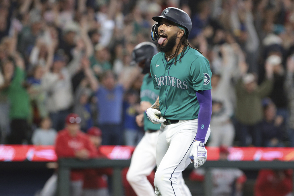 Seattle Mariners' J.P. Crawford reacts after hitting a grand slam off Los Angeles Angels starting pitcher Reid Detmers during the fourth inning of a baseball game Saturday, June 1, 2024, in Seattle.