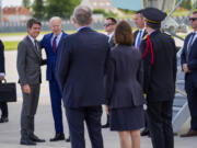 President Joe Biden is welcomed by France's Prime Minister Gabriel Attal, left, after arriving at Orly airport, south of Paris, Wednesday, June 5, 2024. Biden is in France to mark the 80th anniversary of D-Day.