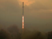 SpaceX's mega rocket Starship lifts off in a heavy haze for a test flight from Starbase in Boca Chica, Texas, Thursday, June 6, 2024.