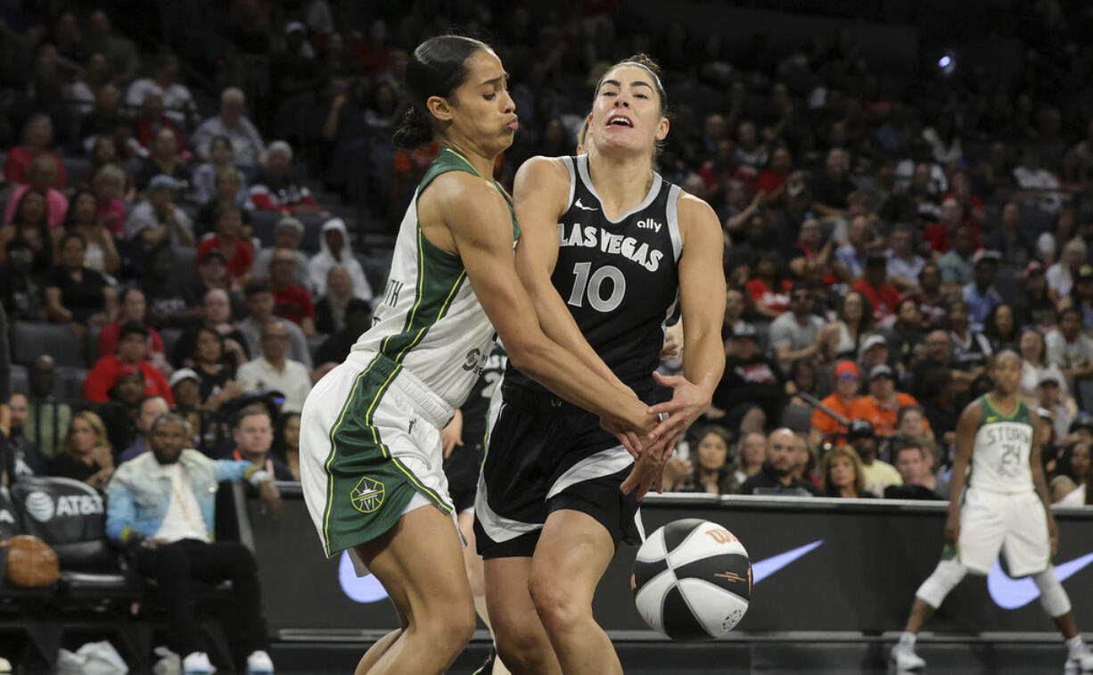 Seattle Storm guard Skylar Diggins-Smith knocks the ball away from Las Vegas Aces guard Kelsey Plum (10) during the first half of a WNBA basketball game in Las Vegas on Friday, June 7, 2024.