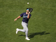 Seattle Mariners Dominic Canzone right fielder catches a fly ball for the out on Kansas City Royals' Salvador Perez during the fifth inning of a baseball game Saturday, June 8, 2024, in Kansas City, Mo.