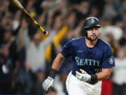 Seattle Mariners' Cal Raleigh flips his bat after hitting a game-winning grand slam against the Chicago White Sox during the ninth inning of a baseball game Monday, June 10, 2024, in Seattle.