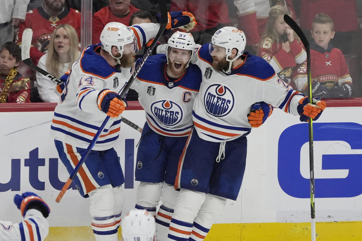 Edmonton Oilers center Connor McDavid (97) celebrates his goal during the third period of Game 5 of the NHL hockey Stanley Cup Finals against the Florida Panthers, Tuesday, June 18, 2024, in Sunrise, Fla. The Oilers defeated the Panthers 5-3.