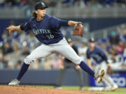 Seattle Mariners' Logan Gilbert delivers a pitch during the first inning of a baseball game against the Miami Marlins, Saturday, June 22, 2024, in Miami.