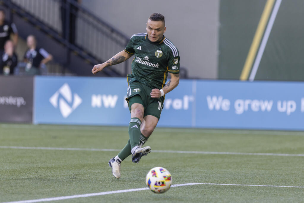 Portland Timbers forward Jonathan Rodríguez shoots against the Vancouver Whitecaps during an MLS soccer match Saturday, June 22, 2024, in Portland, Ore.