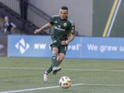 Portland Timbers forward Jonathan Rodríguez shoots against the Vancouver Whitecaps during an MLS soccer match Saturday, June 22, 2024, in Portland, Ore.