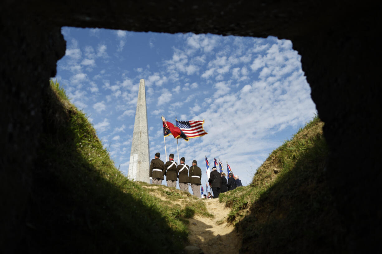 U.S. soldiers attend a wreath-laying ceremony Tuesday at the 1st Infantry Division Monument as part of ceremonies marking the 80th anniversary of D-Day near Omaha Beach in Normandy, France.