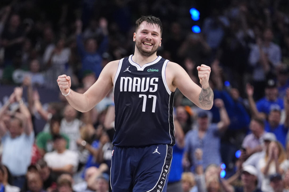 Dallas Mavericks guard Luka Doncic (77) reacts after a play during the first half in Game 4 of the NBA basketball finals against the Boston Celtics, Friday, June 14, 2024, in Dallas.