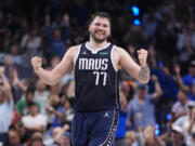 Dallas Mavericks guard Luka Doncic (77) reacts after a play during the first half in Game 4 of the NBA basketball finals against the Boston Celtics, Friday, June 14, 2024, in Dallas.