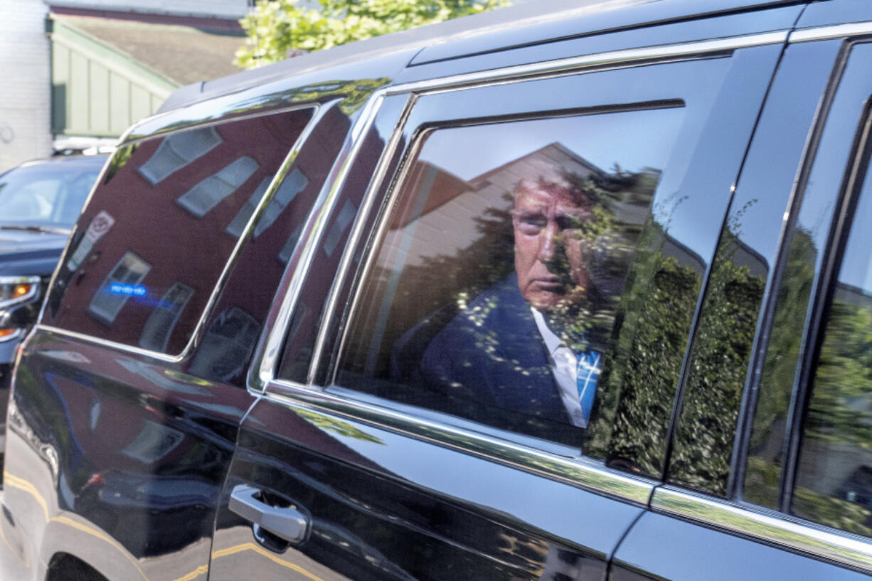 Former President Donald Trump arrives to the Capitol Hill Club, Thursday, June 13, 2024, in Washington.