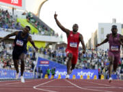 Noah Lyles celebrates after winning the men&rsquo;s 100-meter final during the U.S. Olympic Trials Sunday in Eugene, Ore.