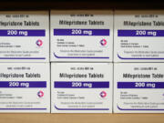 FILE - Boxes of the drug mifepristone sit on a shelf at the West Alabama Women&#039;s Center in Tuscaloosa, Ala., on March 16, 2022. Louisiana Gov. Jeff Landry has signed a first-of-its-kind bill Friday, May 24, classifying two abortion-inducing drugs, mifepristone and misoprostol, as controlled and dangerous substances. (AP Photo/Allen G.