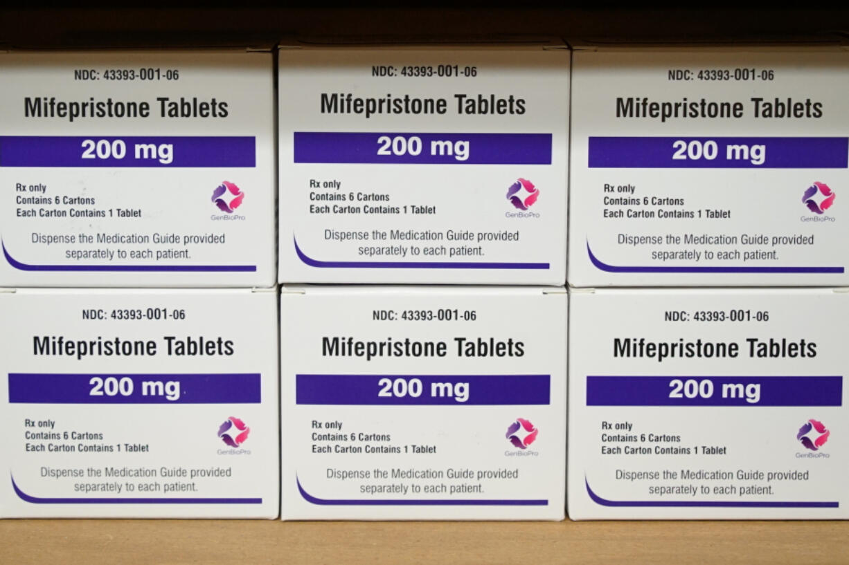 FILE - Boxes of the drug mifepristone sit on a shelf at the West Alabama Women&#039;s Center in Tuscaloosa, Ala., on March 16, 2022. Louisiana Gov. Jeff Landry has signed a first-of-its-kind bill Friday, May 24, classifying two abortion-inducing drugs, mifepristone and misoprostol, as controlled and dangerous substances. (AP Photo/Allen G.