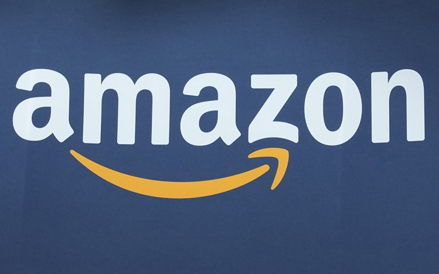 FILE - The Amazon logo is seen, June 15, 2023, at the Vivatech show in Paris.  Amazon is moving from putting plastic air pillows in its packages to using recycled paper filling instead, a move that&rsquo;s more environmentally friendly and secures items in boxes better. The company said Thursday, June 20, 2024  that it&rsquo;s already replaced 95% of the plastic air fillers with paper filler in North America and is working toward complete removal by year&rsquo;s end.