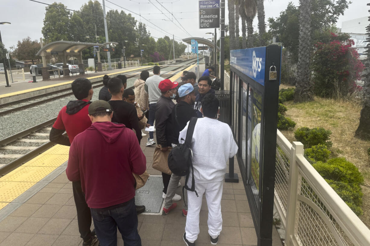 Migrants released with notices to appear in immigration court wait for a train to the San Diego International Airport in San Diego, Calif., Thursday, June 6, 2024. President Joe Biden has suspended asylum processing at the U.S. border under a new policy unveiled this week. But the proclamation has an exception for &ldquo;operational considerations.&rdquo;  The Homeland Security Department said in a detailed document outlining the ban that &ldquo;demographics and nationalities encountered at the border significantly impact&rdquo; its ability to deport people.