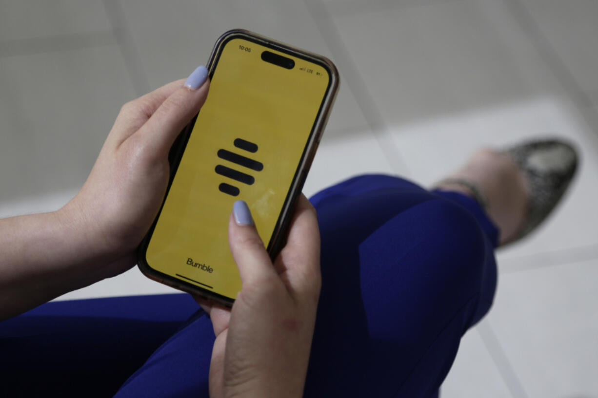 The dating app Bumble is shown on a smart phone on Wednesday, June 26, 2024, in New York. Plenty of happy couples can trace their meet-cute moment to an online dating app. But many others find the never-ending process of likes, swipes, taps and awkward DMs that go nowhere to be exhausting.