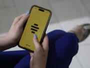 The dating app Bumble is shown on a smart phone on Wednesday, June 26, 2024, in New York. Plenty of happy couples can trace their meet-cute moment to an online dating app. But many others find the never-ending process of likes, swipes, taps and awkward DMs that go nowhere to be exhausting.