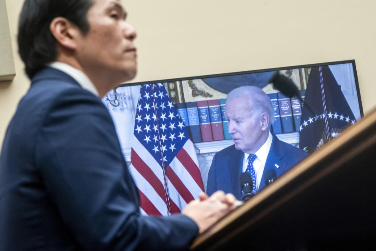 FILE - Special Counsel Robert Hur listens to recorded remarks of President Joe Biden during a hearing of the House Judiciary Committee in the Rayburn Office Building on Capitol Hill in Washington, March 12, 2024.