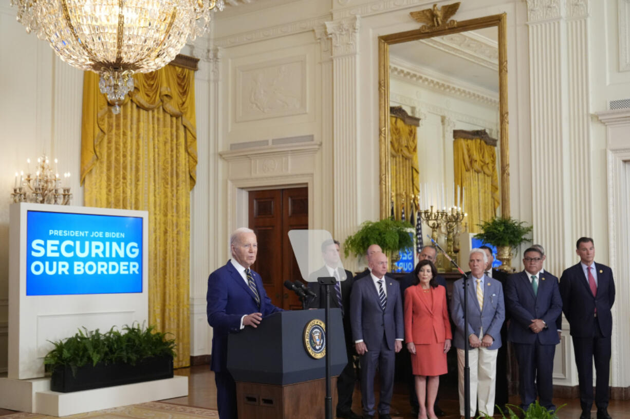 President Joe Biden, left, speaks about an executive order in the East Room at the White House in Washington, Tuesday, June 4, 2024. Biden unveiled plans to enact immediate significant restrictions on migrants seeking asylum at the U.S.-Mexico border as the White House tries to neutralize immigration as a political liability ahead of the November elections.