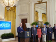 President Joe Biden, left, speaks about an executive order in the East Room at the White House in Washington, Tuesday, June 4, 2024. Biden unveiled plans to enact immediate significant restrictions on migrants seeking asylum at the U.S.-Mexico border as the White House tries to neutralize immigration as a political liability ahead of the November elections.