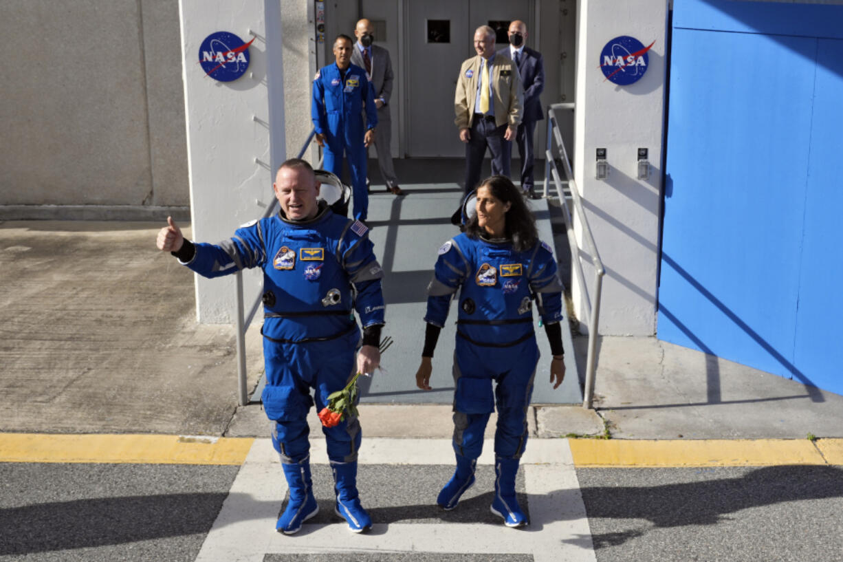 NASA astronauts Butch Wilmore, left, and Suni Williams leave the operations and checkout building for a trip to launch pad at Space Launch Complex 41 Saturday, June 1, 2024, in Cape Canaveral, Fla. The two astronauts are scheduled to liftoff later today on the Boeing Starliner capsule for a trip to the international space station. .