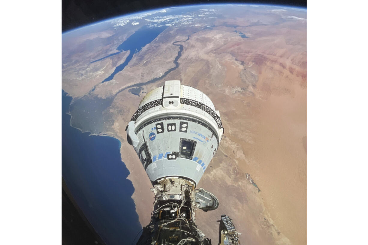 This photo provided by NASA shows the Starliner spacecraft docked to the Harmony module of the International Space Station, orbiting 262 miles above Egypt&#039;s Mediterranean coast, on June 13, 2024.