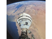 This photo provided by NASA shows the Starliner spacecraft docked to the Harmony module of the International Space Station, orbiting 262 miles above Egypt&#039;s Mediterranean coast, on June 13, 2024.