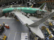 FILE - In this photo taken with a fish-eye lens, a Boeing 737 MAX 8 airplane sits on the assembly line during a brief media tour in Boeing&#039;s 737 assembly facility in Renton, Wash., March 27, 2019. Boeing had another weak month for aircraft sales in May 2024, taking orders for just four new planes. (AP Photo/Ted S.