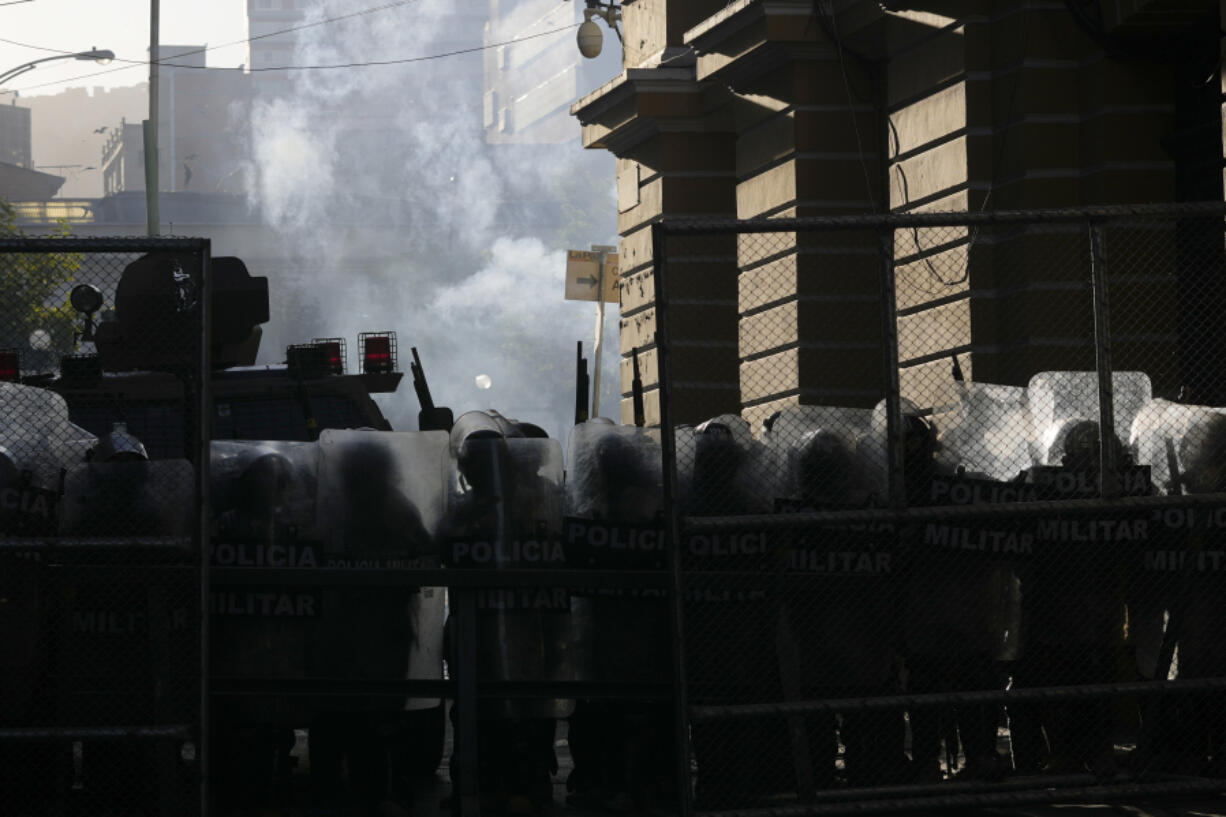 Military police block the entrance to Plaza Murillo in La Paz, Bolivia, Wednesday, June 26, 2024. Armored vehicles rammed the doors of Bolivia&rsquo;s government palace located in Plaza Murillo, in an apparent coup attempt against President Luis Arce, but he vowed to stand firm and named a new army commander who ordered troops to stand down.