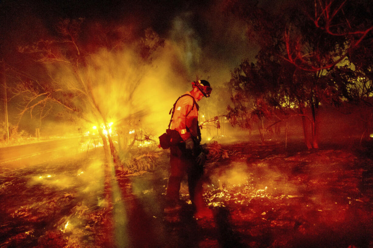 Firefighter Chris Fritz works to keep the Aero Fire from spreading through the Copperopolis community of Calaveras County, Calif., on Monday, June 17, 2024.