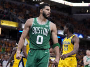 Boston Celtics forward Jayson Tatum (0) reacts after making a basket during the first half of Game 4 of the NBA Eastern Conference basketball finals against the Indiana Pacers, Monday, May 27, 2024, in Indianapolis.
