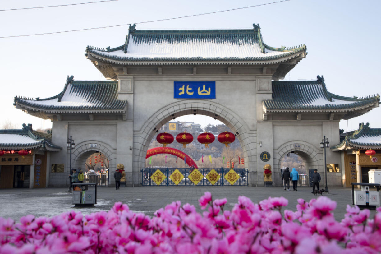 Tourists walk past a gateway with the name &ldquo;Beishan&rdquo; seen at the Beishan Park in northeastern China&rsquo;s Jilin province on Jan 23, 2020. Four instructors from Iowa&rsquo;s Cornell College teaching at Beihua University in northeastern China were attacked in the Beishan public park, reportedly with a knife, officials at the U.S. school and the State Department said Tuesday, June 11, 2024.